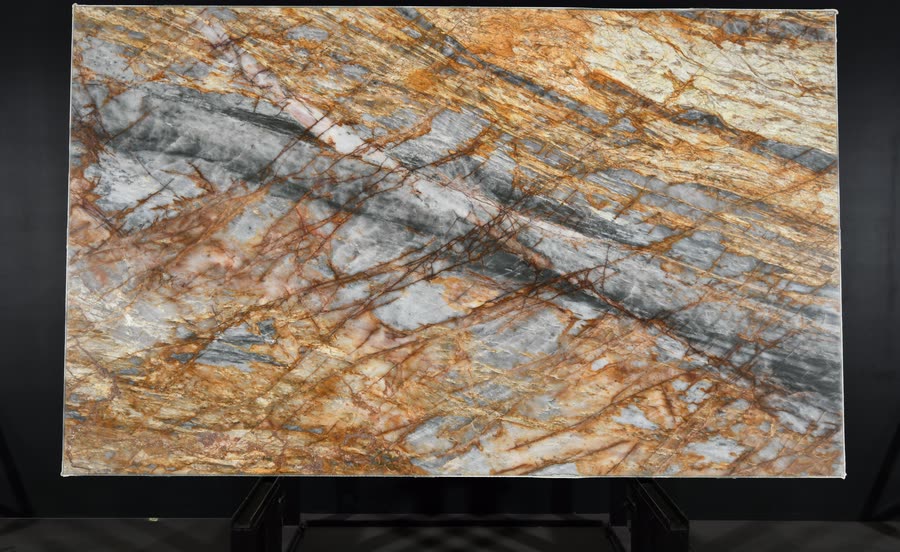 A full Nebula Crystal slab photographed square on against a black studio background, its grey and cream field crossed by rust-orange and deep red veining.